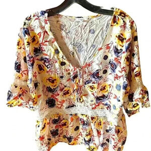 Maurice’s 0X cream pansy blouse with blue & yellow flowers. Cream lace detail .